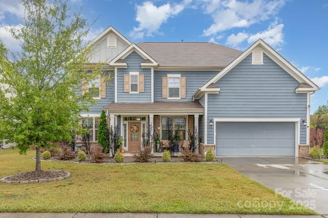 a front view of a house with swimming pool