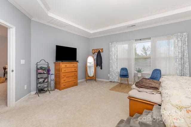 a view of a livingroom with furniture and a flat screen tv