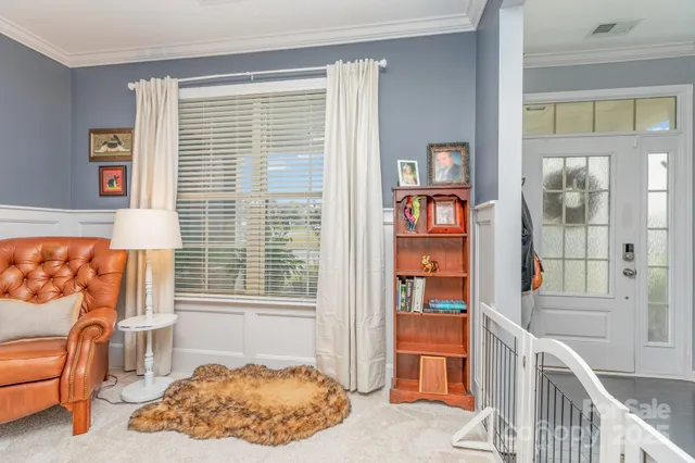 a bedroom with furniture and a window