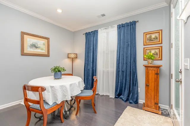 a dining room with a table and chairs
