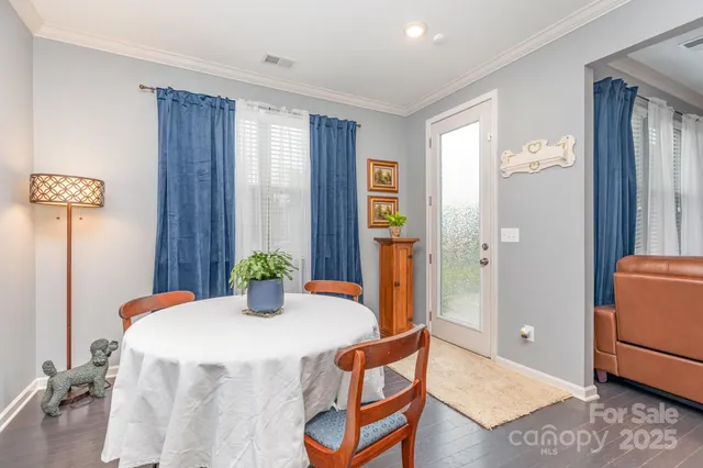 a kitchen with a table and chairs