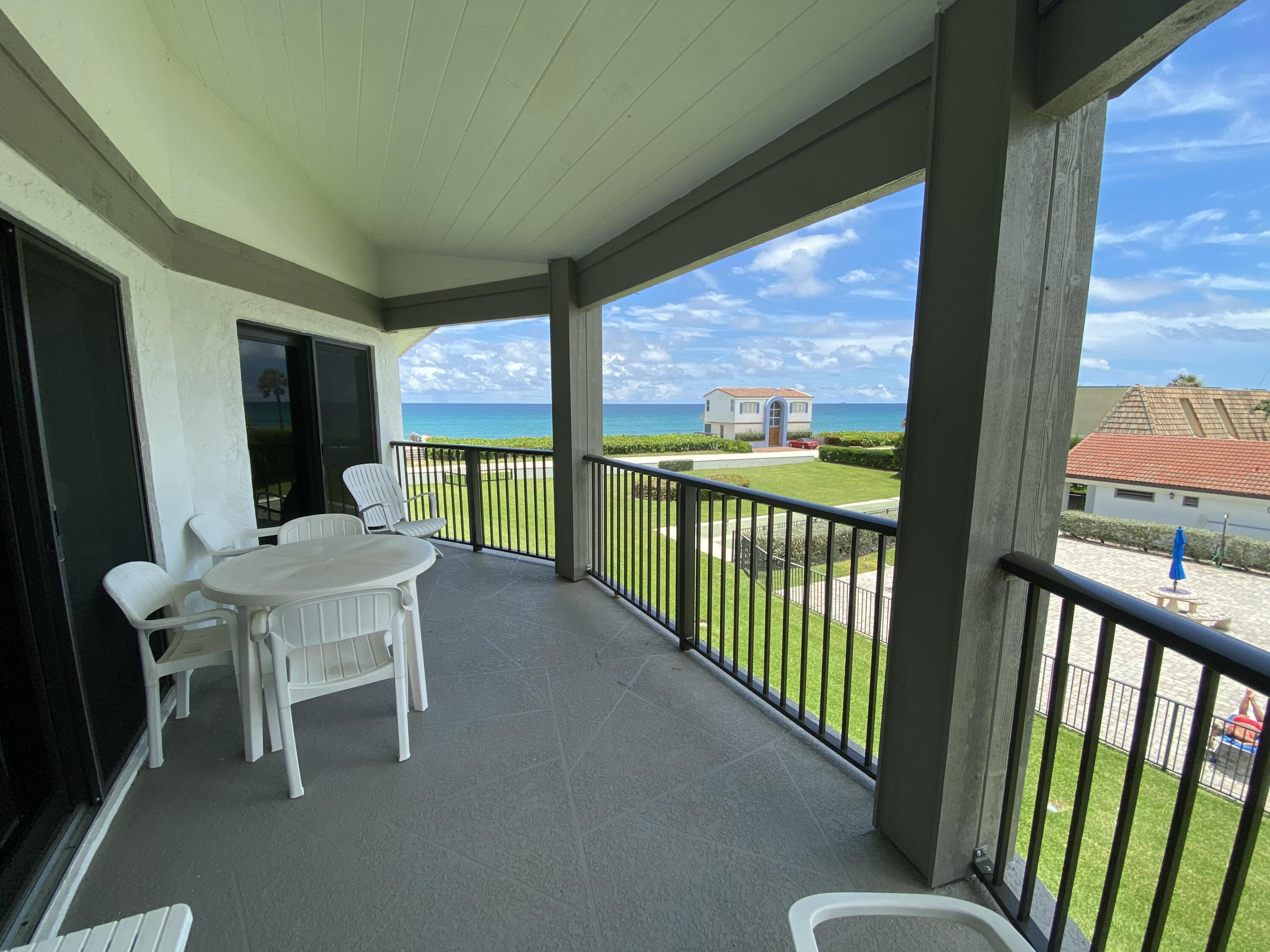 a view of a porch with furniture and outside view