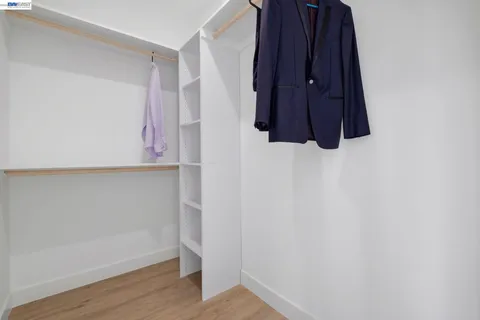 a room with a walk in closet and a window