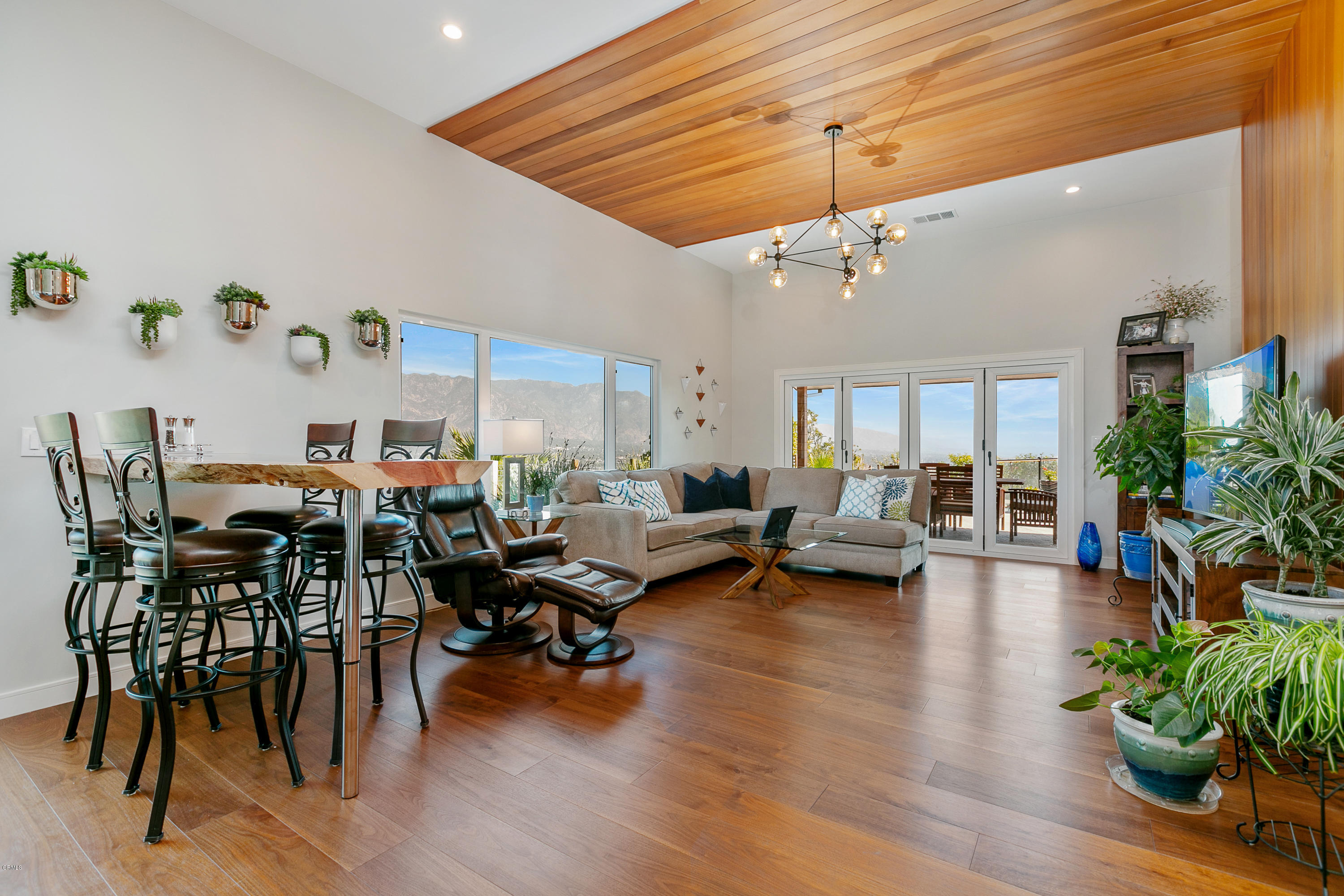 770 Panorama Place Pasadena, CA 91105 - Photo 10 of 47 a living room with furniture kitchen view and a wooden floor