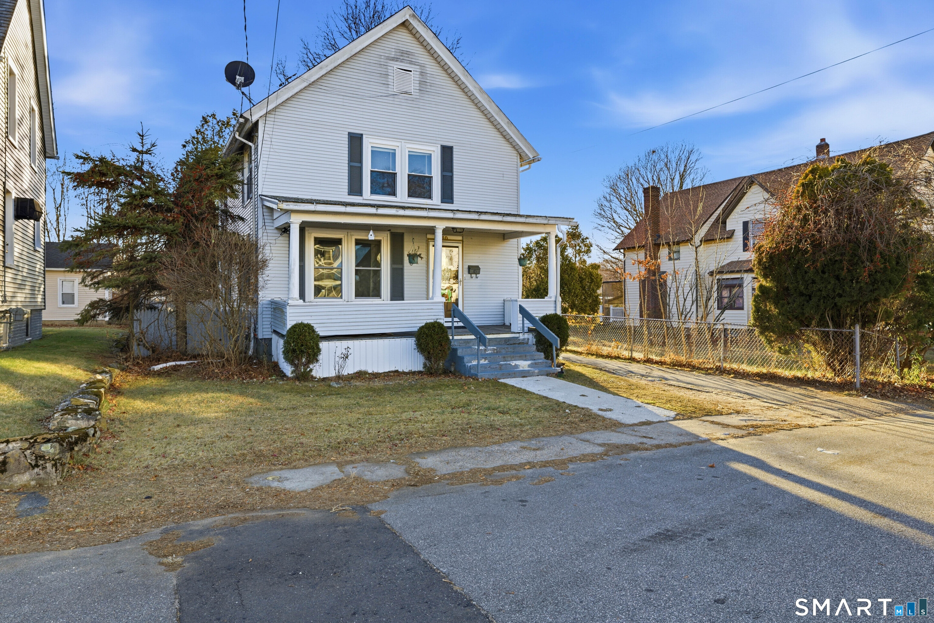 10 Russell Road Norwich, CT 06360 - Photo 1 of 33 a view of a white house with a large windows next to a yard