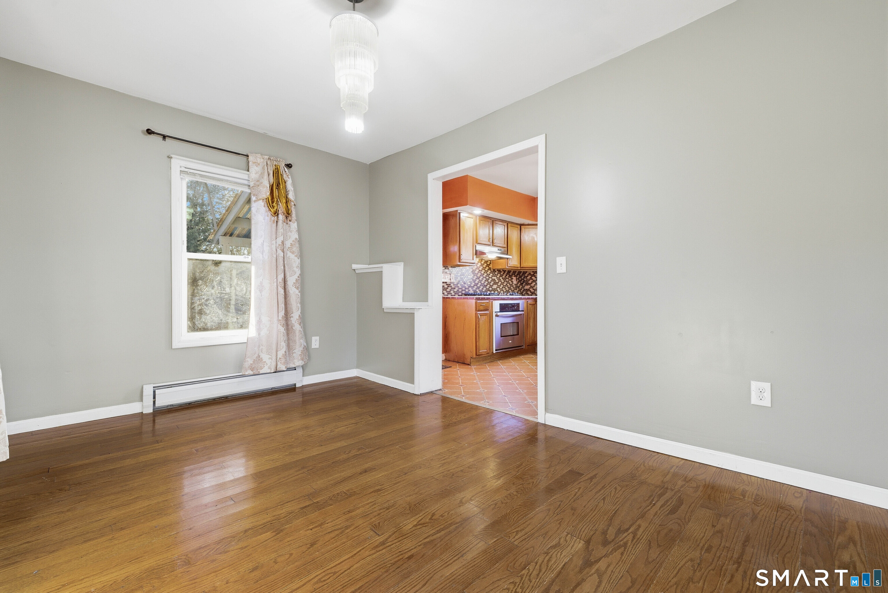 10 Russell Road Norwich, CT 06360 - Photo 11 of 33 wooden floor in an empty room with a window