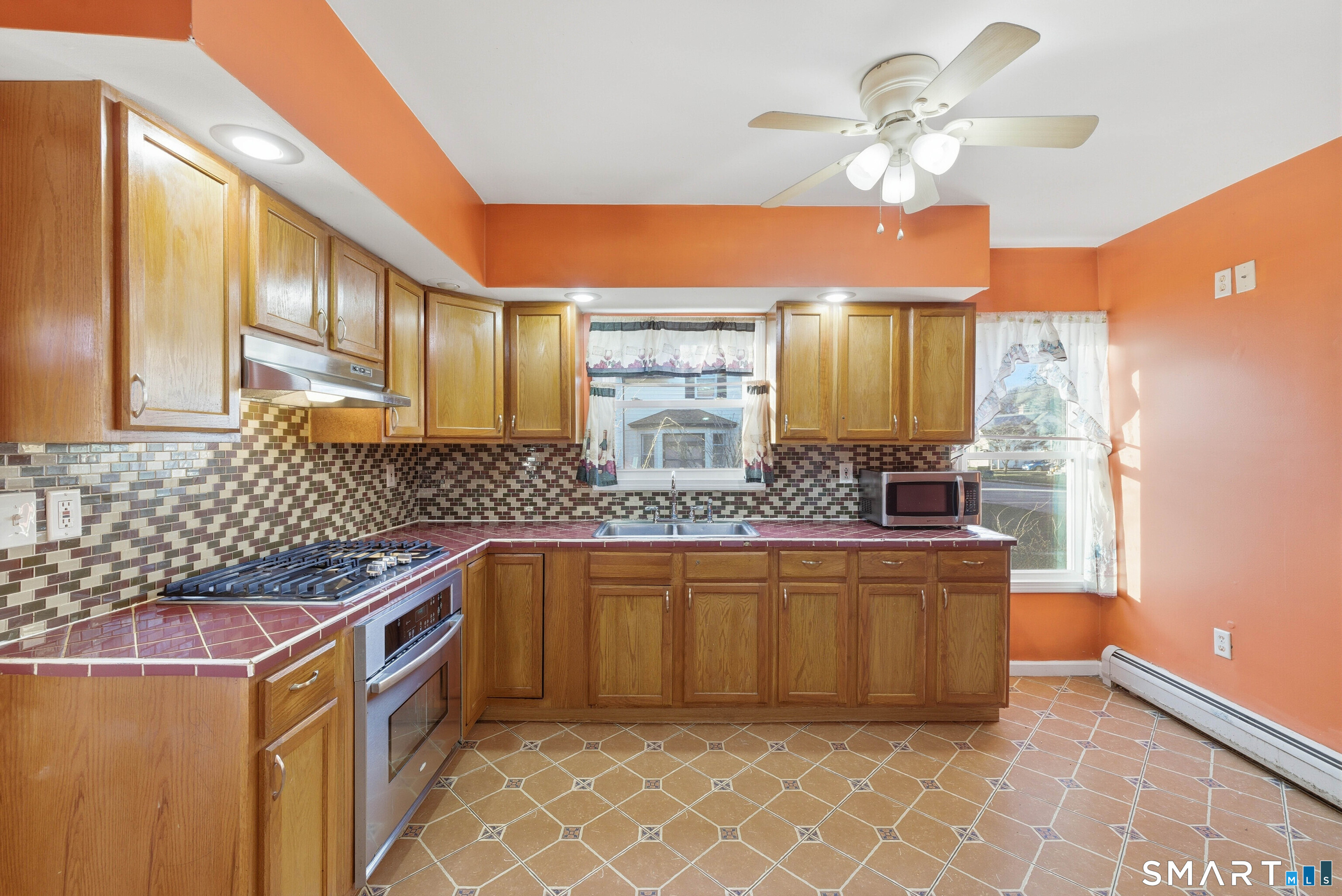 10 Russell Road Norwich, CT 06360 - Photo 14 of 33 a kitchen with stainless steel appliances granite countertop a sink and a refrigerator