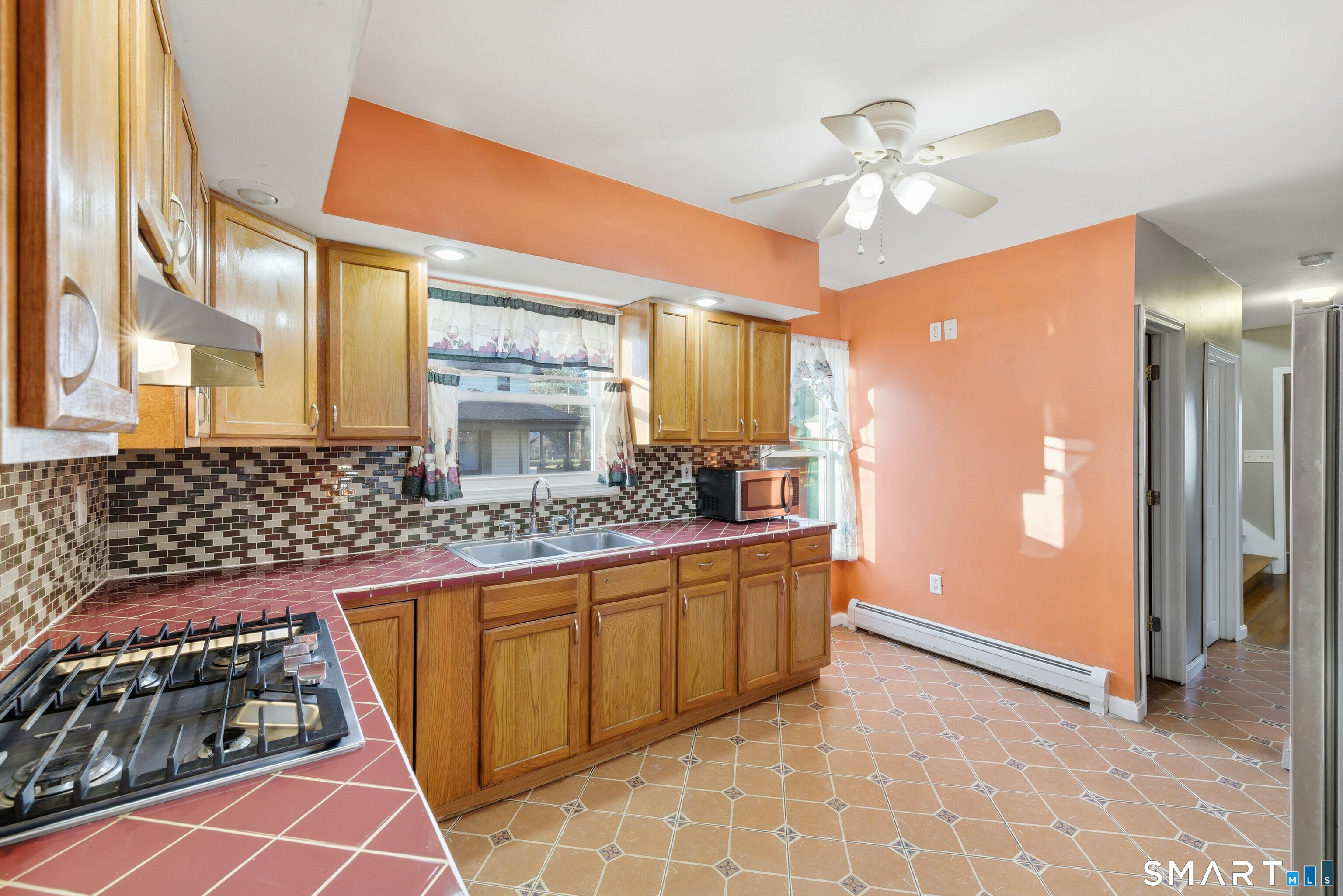 10 Russell Road Norwich, CT 06360 - Photo 15 of 33 a bathroom with a sink a mirror and a shower