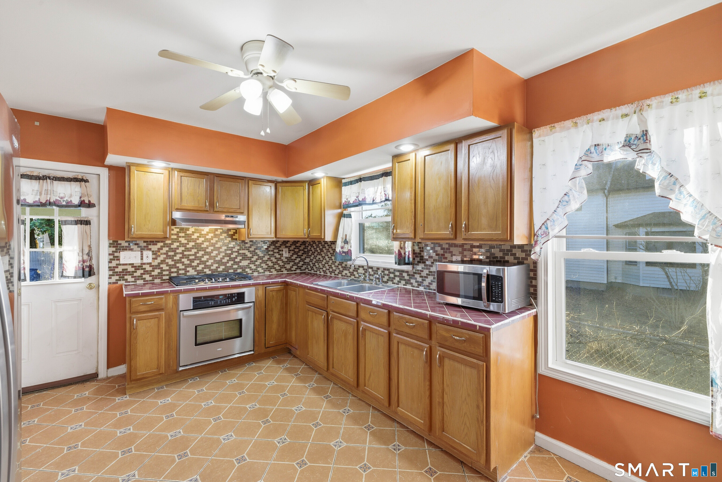 10 Russell Road Norwich, CT 06360 - Photo 16 of 33 a kitchen with stainless steel appliances granite countertop a stove and a sink