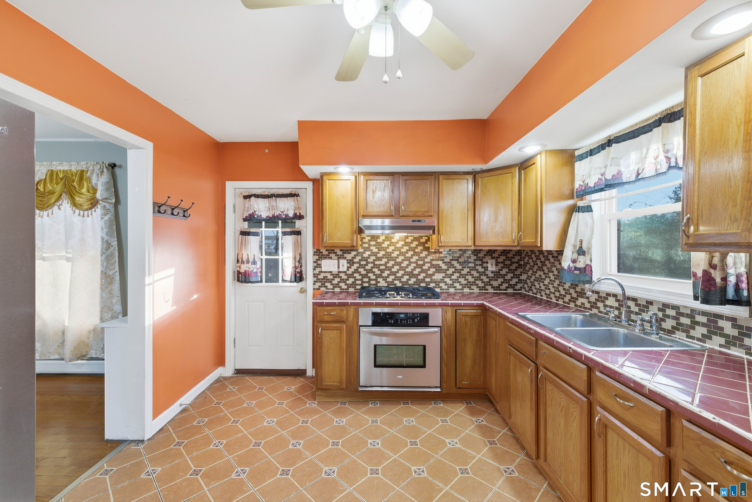 10 Russell Road Norwich, CT 06360 - Photo 17 of 33 a kitchen with stainless steel appliances granite countertop a sink stove and refrigerator