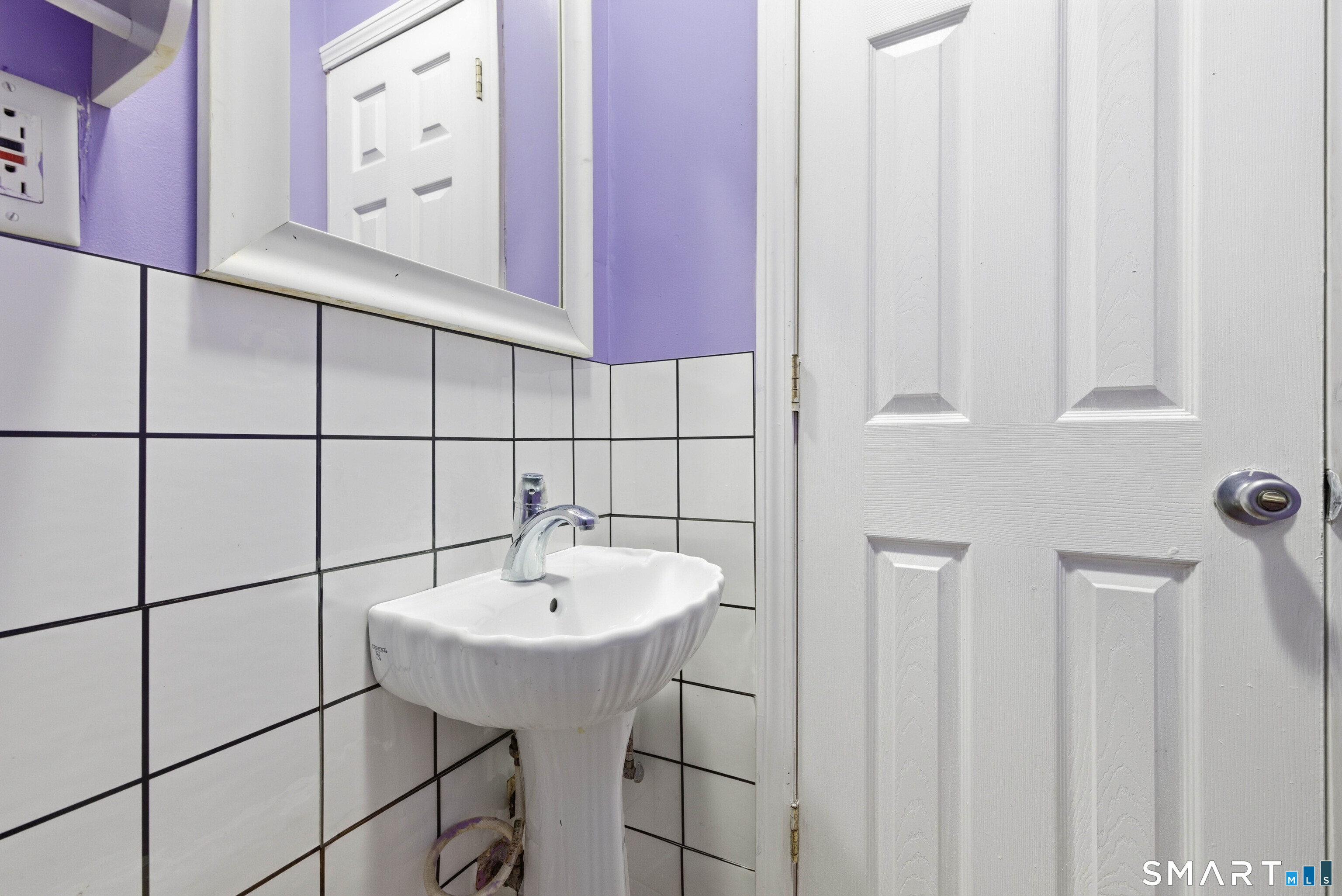 10 Russell Road Norwich, CT 06360 - Photo 20 of 33 a bathroom with a sink and a mirror