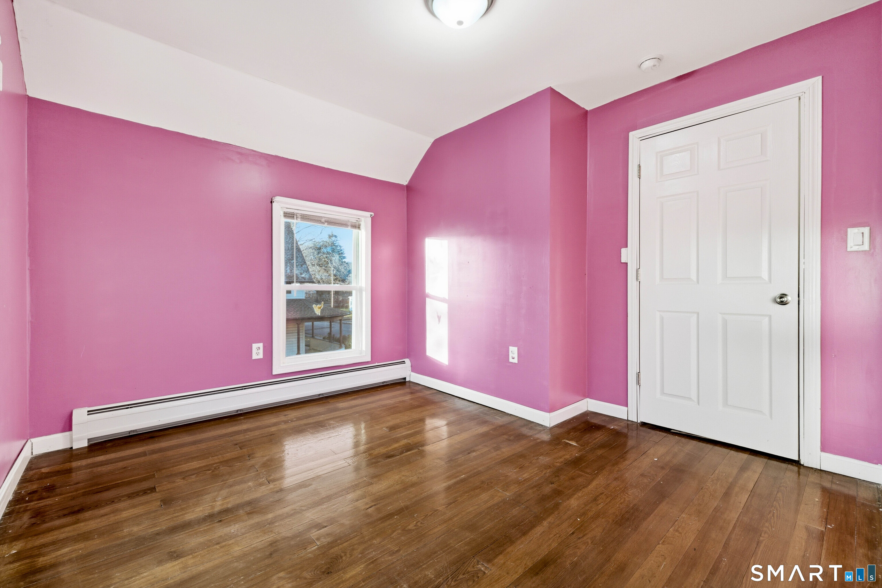 10 Russell Road Norwich, CT 06360 - Photo 25 of 33 a view of empty room with wooden floor and fan