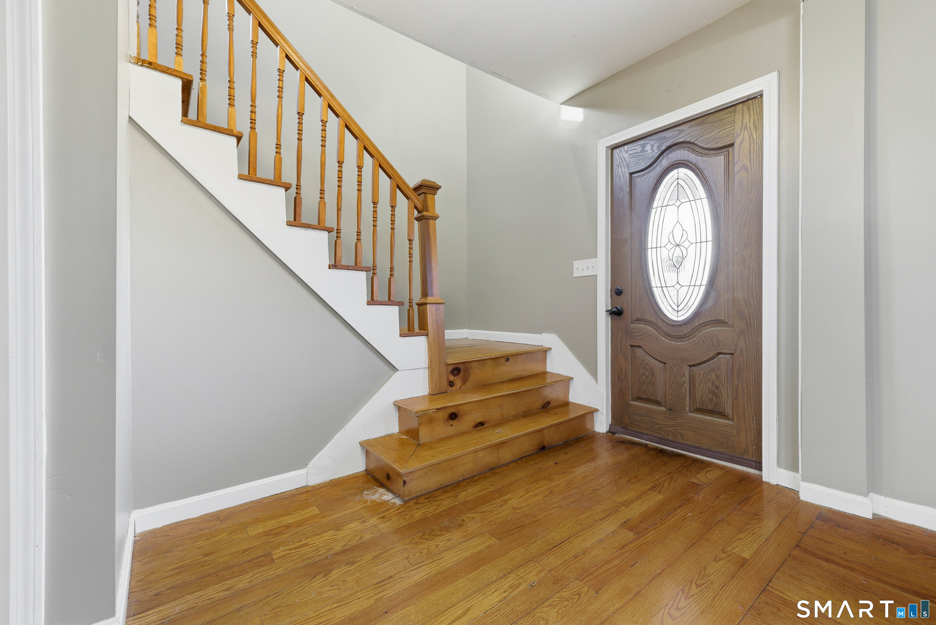 10 Russell Road Norwich, CT 06360 - Photo 5 of 33 a view of entryway with wooden floor