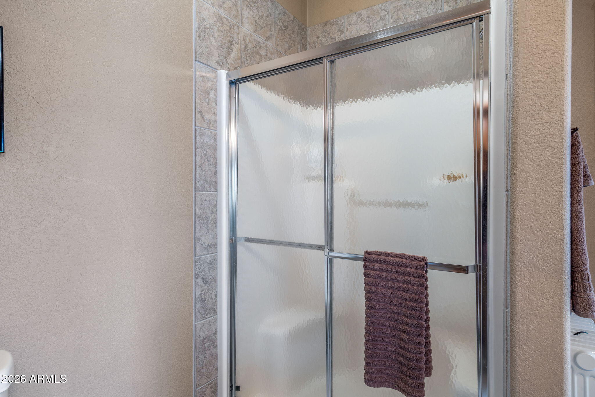 758 Southlake Road Lakeside, AZ 85929 - Photo 69 of 95 a bathroom with a glass shower door