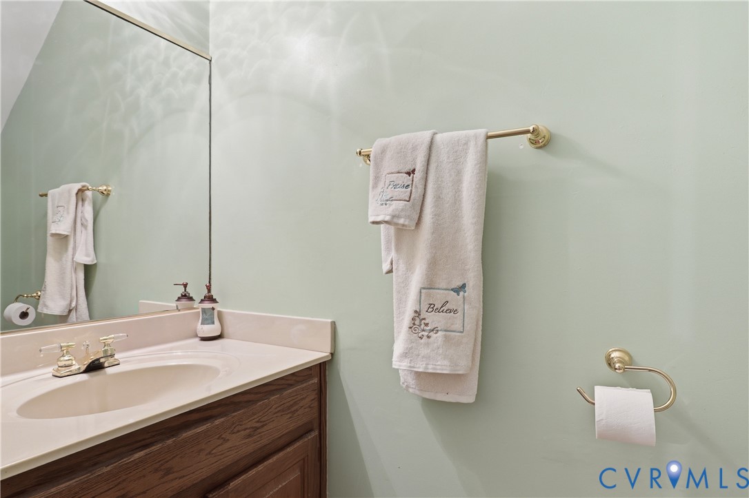 12512 2nd Branch Road Chesterfield, VA 23838 - Photo 20 of 56 a bathroom with a sink and a mirror