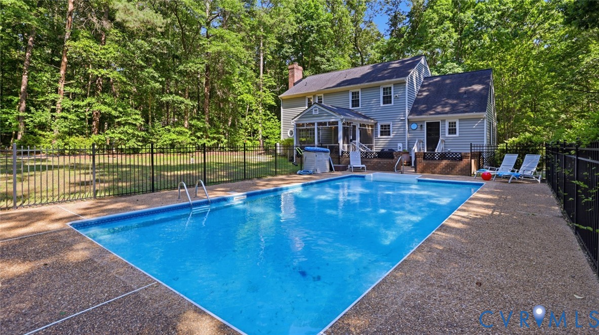 10716 Chalkley Road Richmond, VA 23237 - Photo 41 of 46 a view of house with yard outdoor seating and swimming pool