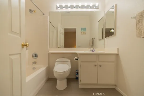 a bathroom with a sink double vanity and a mirror
