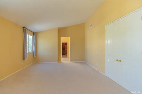 a kitchen with a refrigerator and cabinets