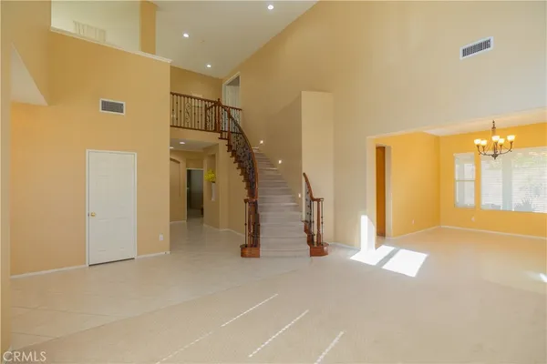 a view of a livingroom with furniture and a ceiling fan