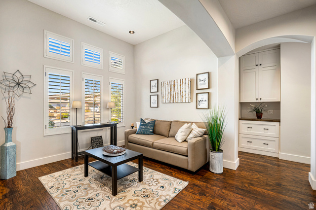 2311 South 1340 West St. George, UT 84770 - Photo 9 of 56 Living room featuring dark wood finished floors and a high ceiling
