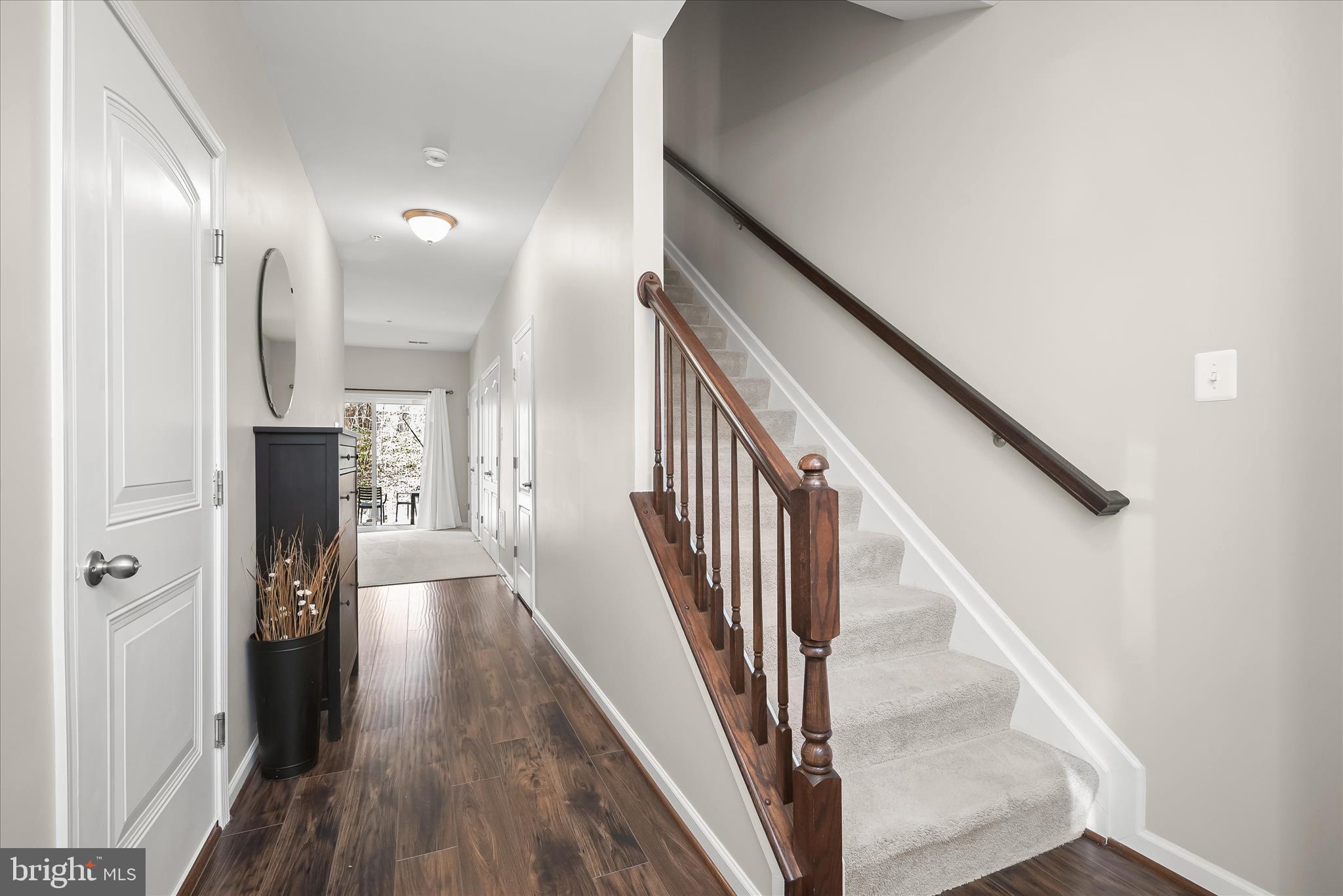 9890 Deer Run Laurel, MD 20723 - Photo 23 of 47 a view of a hallway with wooden floor and staircase