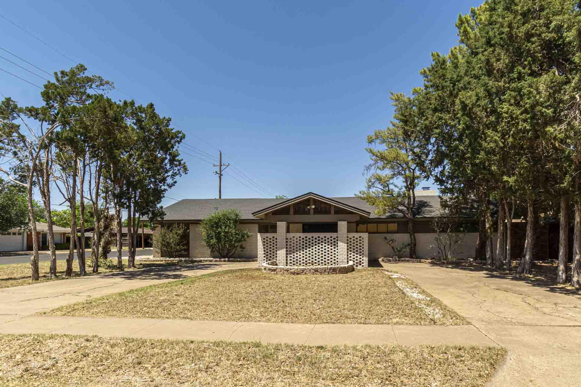 2136 57th Street Lubbock, TX 79412 - Photo 40 of 41 a house with trees in front of it