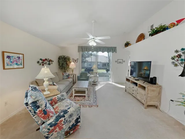 a living room with furniture and a piano