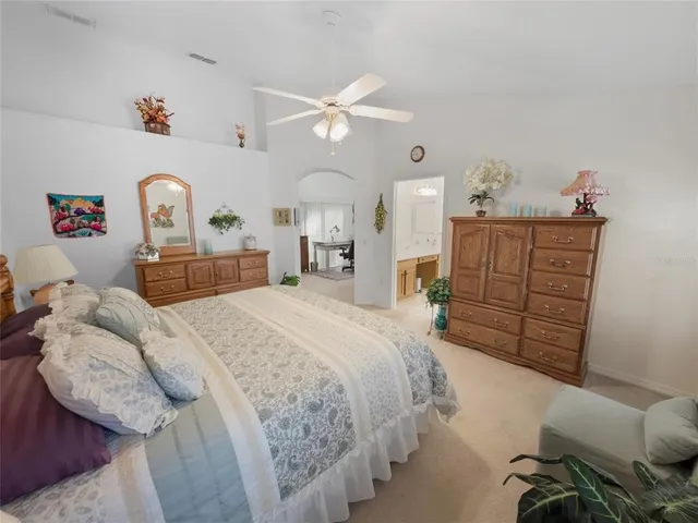 a bathroom with a shower sink and vanity