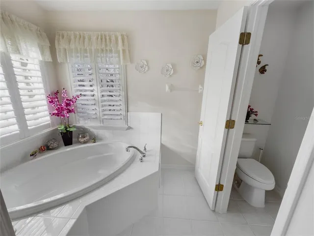a bathroom with a sink double vanity and a tub