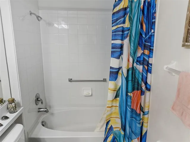 a view of a house with backyard and porch