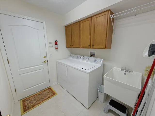 an aerial view of residential houses with outdoor space and swimming pool