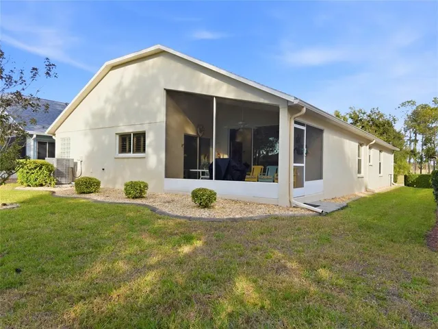 a living room with lots of furniture and a wooden floor