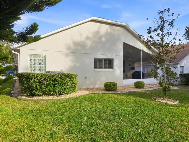 a view of a livingroom with furniture and a bookshelf