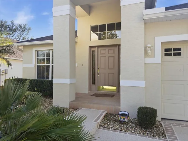 a balcony with furniture and a potted plant