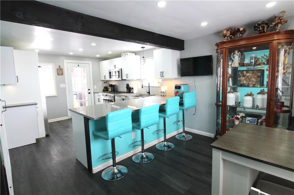 5877 Pleasant Street South Park, PA 15129 - Photo 12 of 34 a view of a dining room with furniture window and wooden floor