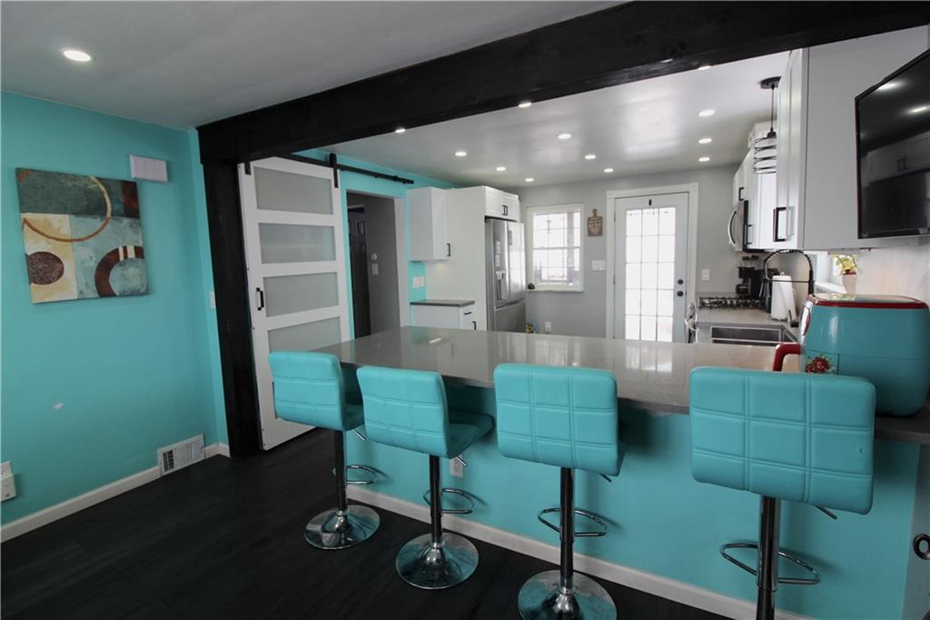 5877 Pleasant Street South Park, PA 15129 - Photo 15 of 34 a living room with furniture and a flat screen tv