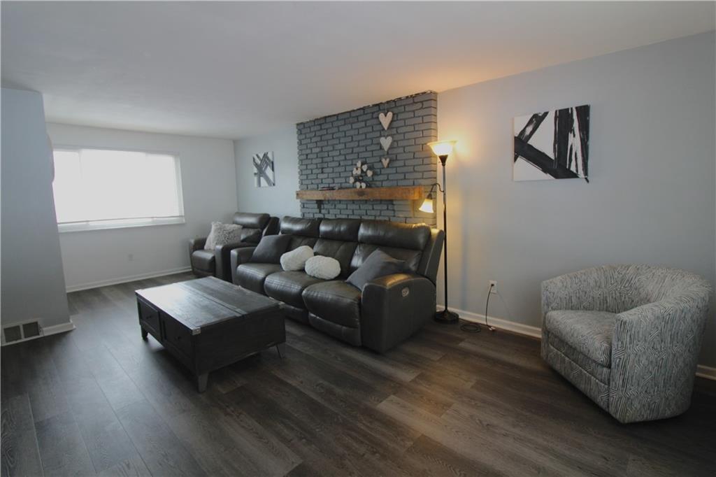 5877 Pleasant Street South Park, PA 15129 - Photo 16 of 34 a living room with furniture and a wooden floor