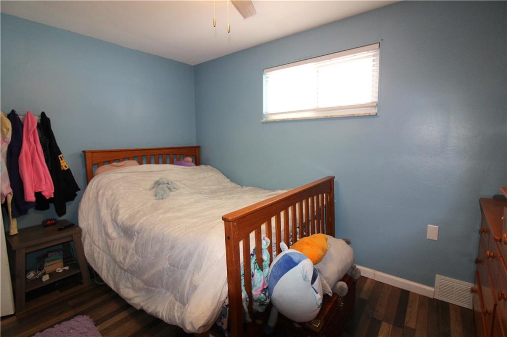 5877 Pleasant Street South Park, PA 15129 - Photo 29 of 34 a bed sitting in a bedroom next to a window