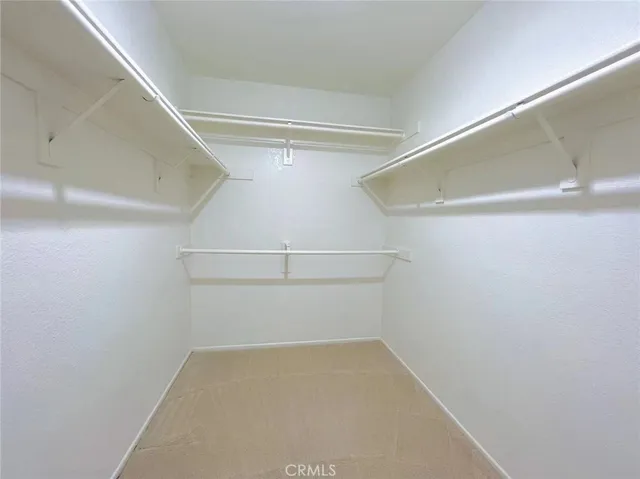 an empty room with a empty space and a window