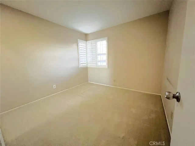 a bathroom with a double vanity sink toilet and a tub
