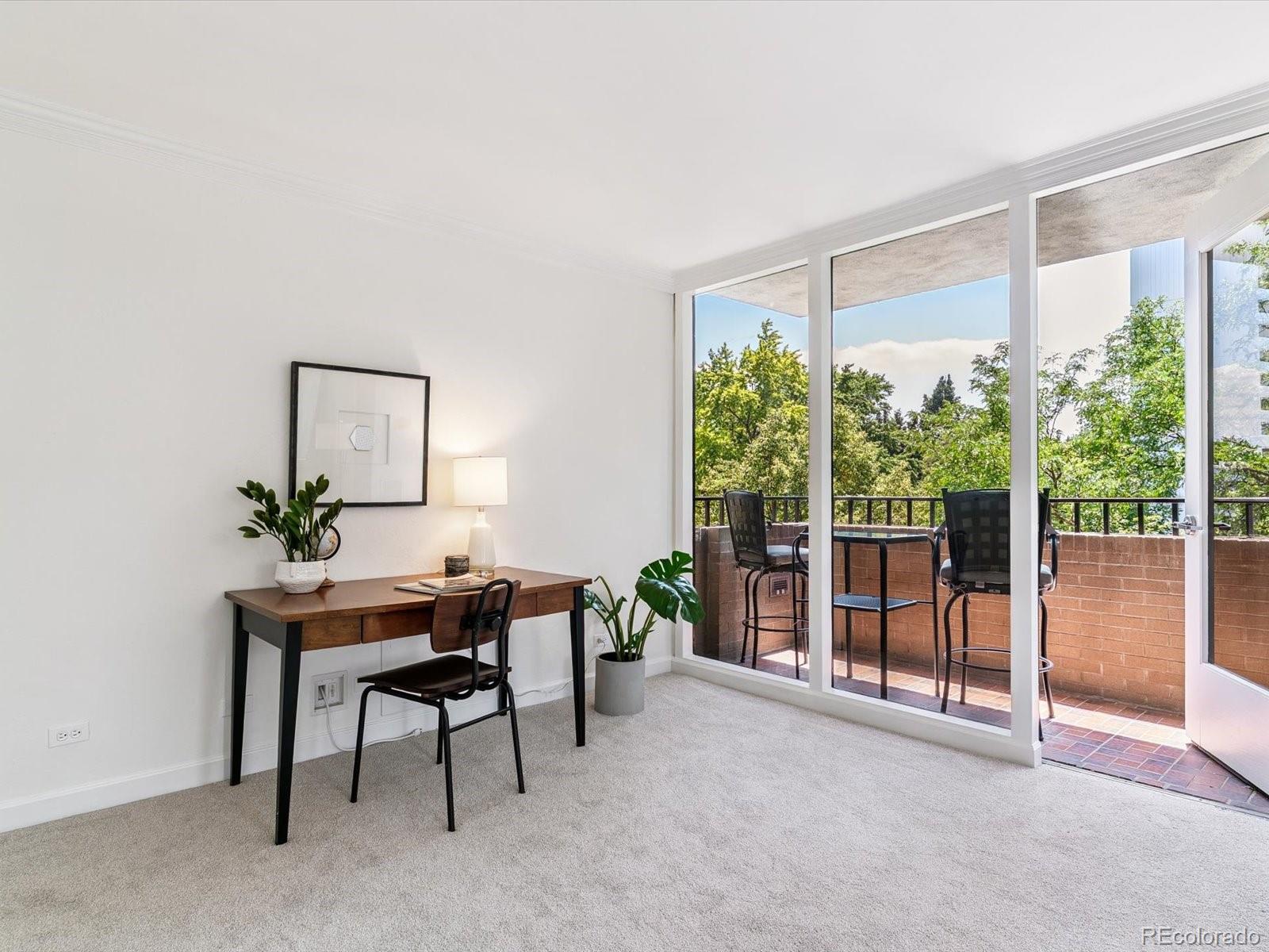 1111 Race Street, Unit 3A Denver, CO 80206 - Photo 11 of 39 a view of a workspace with furniture and a window