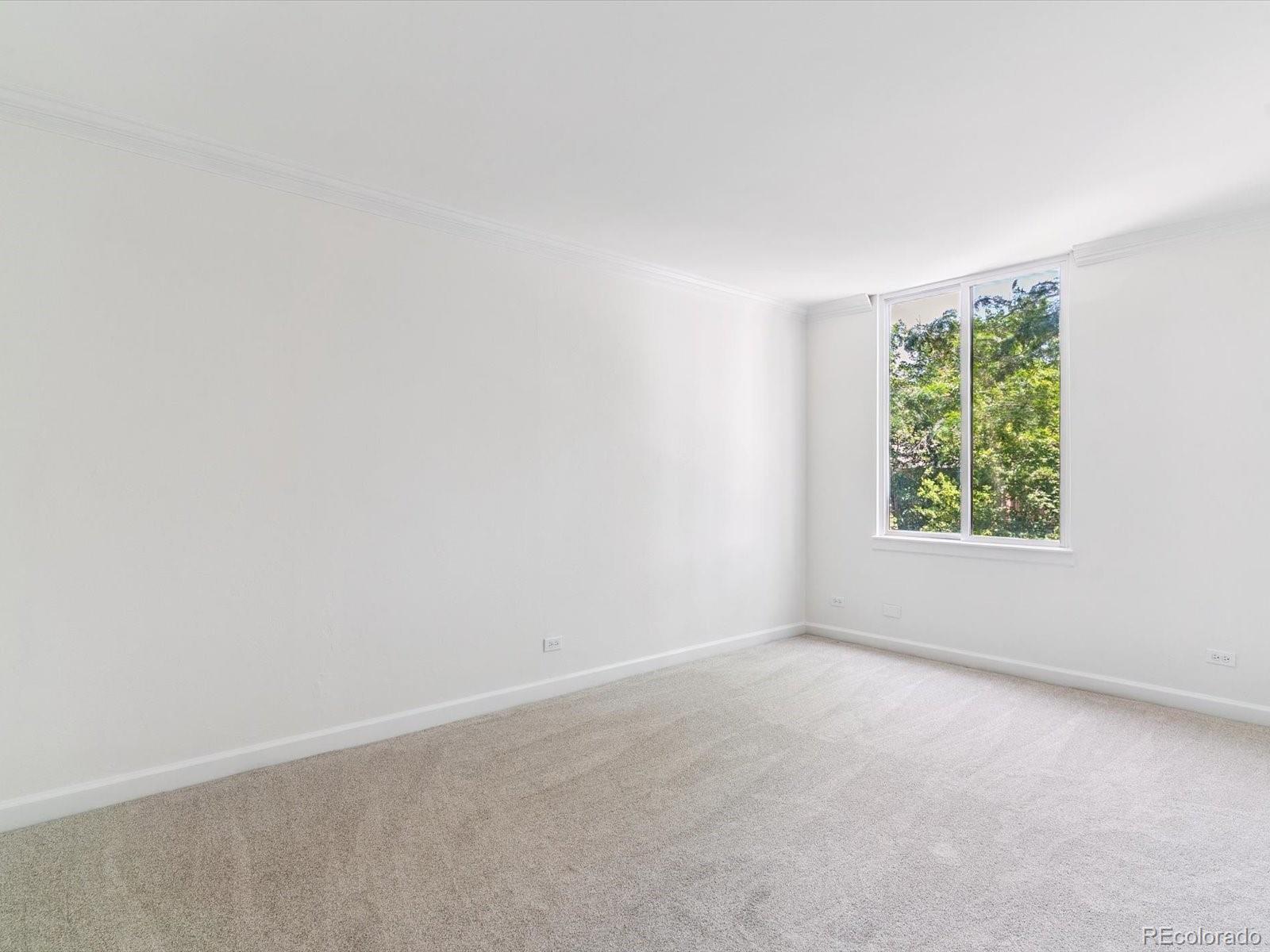 1111 Race Street, Unit 3A Denver, CO 80206 - Photo 14 of 39 an empty room with windows