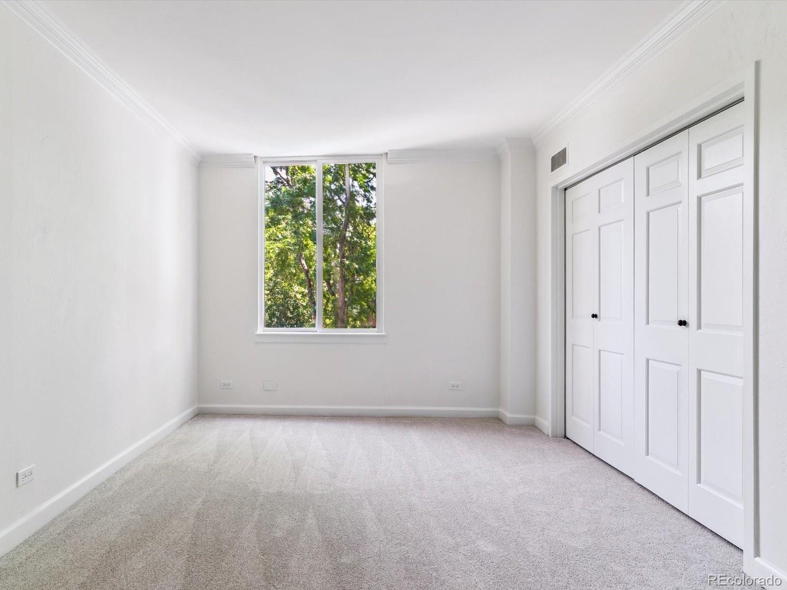 1111 Race Street, Unit 3A Denver, CO 80206 - Photo 15 of 39 a view of an empty room with a window