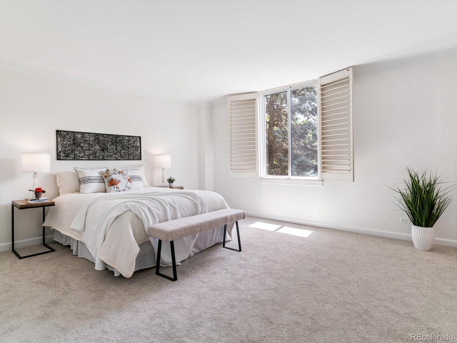 1111 Race Street, Unit 3A Denver, CO 80206 - Photo 18 of 39 a spacious bedroom with a large bed and a window