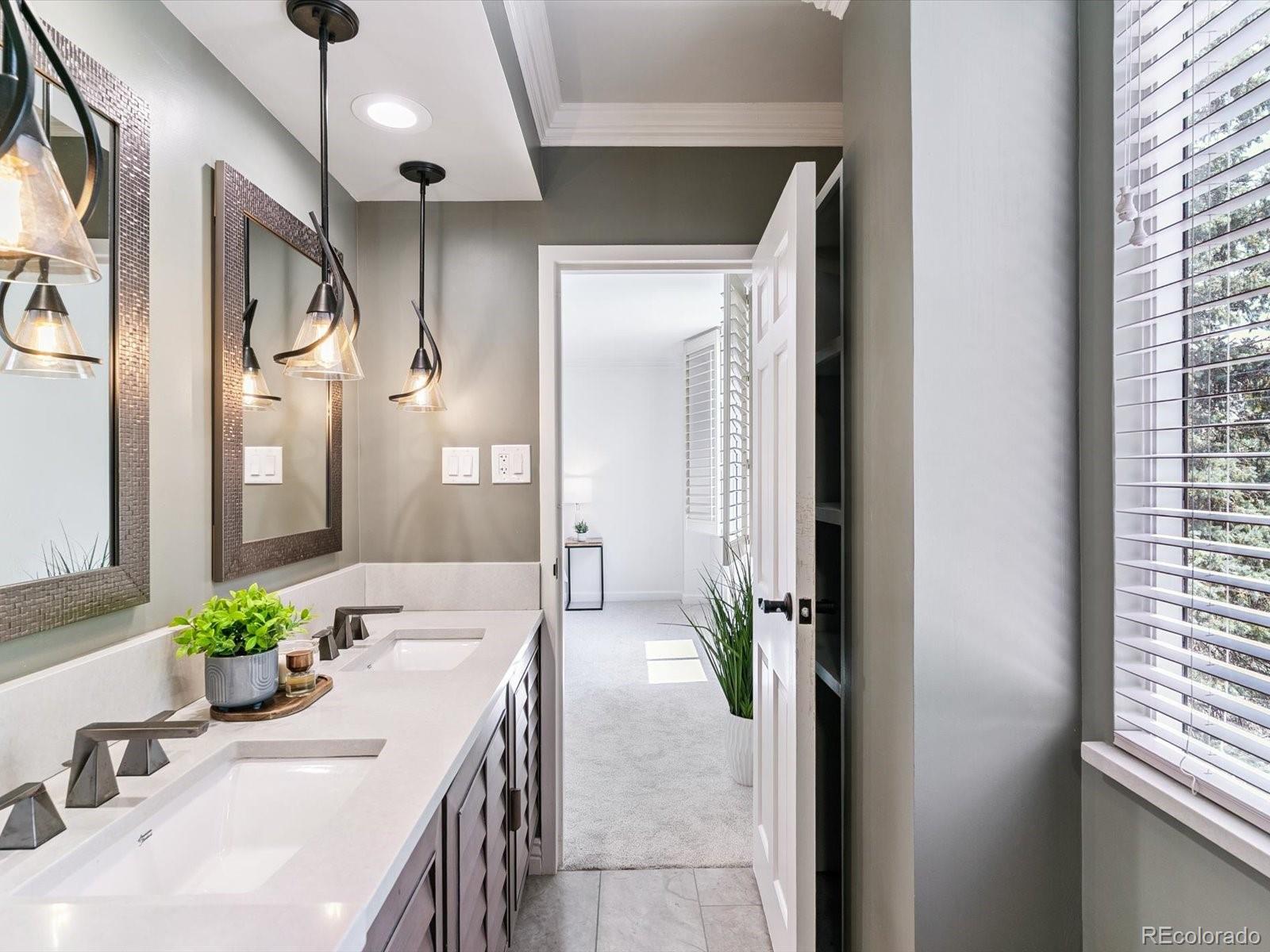 1111 Race Street, Unit 3A Denver, CO 80206 - Photo 22 of 39 a bathroom with a granite countertop sink a mirror and a shower