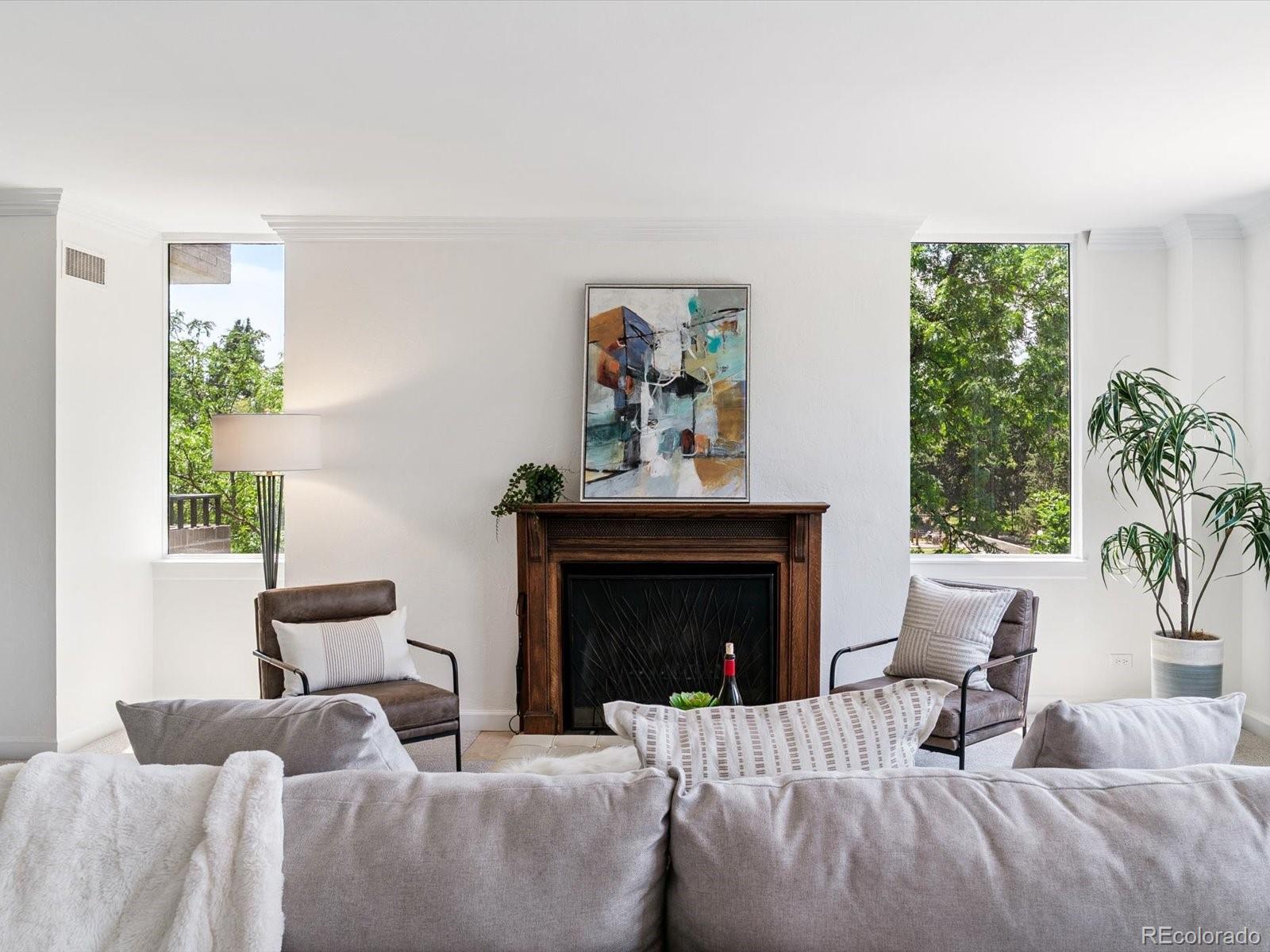 1111 Race Street, Unit 3A Denver, CO 80206 - Photo 6 of 39 a living room with furniture and a fireplace