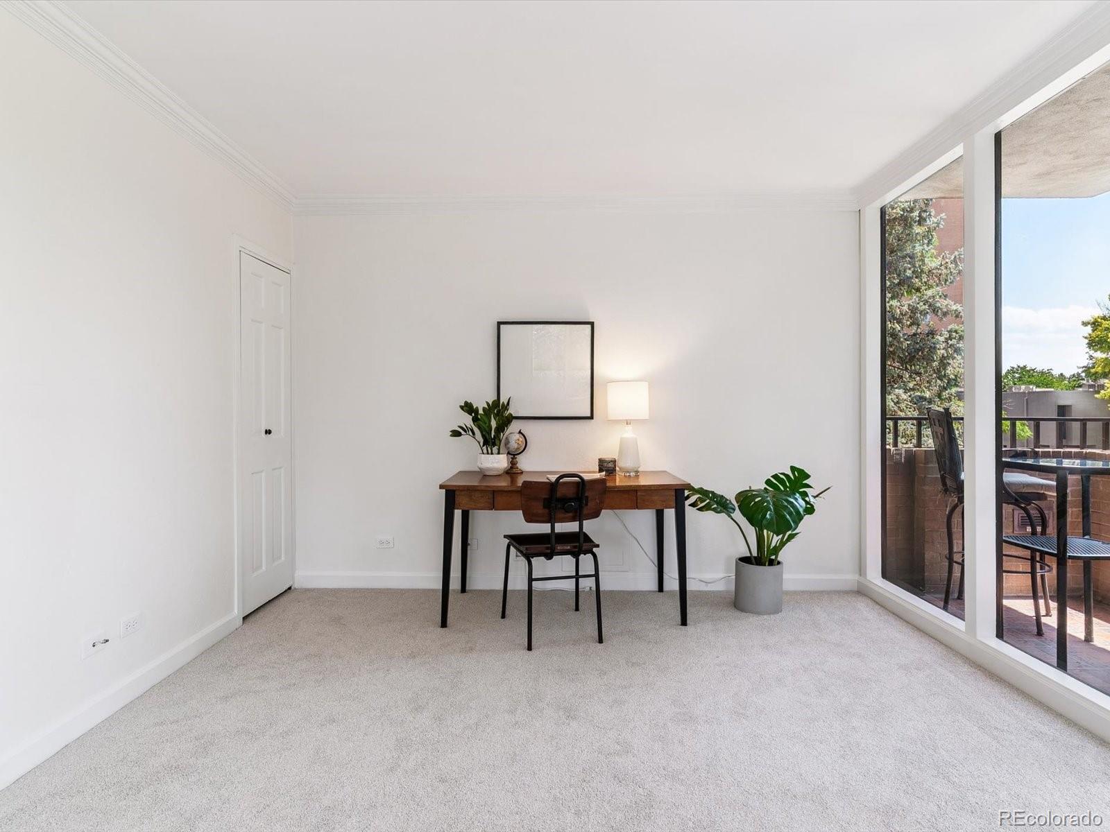 1111 Race Street, Unit 3A Denver, CO 80206 - Photo 10 of 39 a workspace with furniture and a potted plant