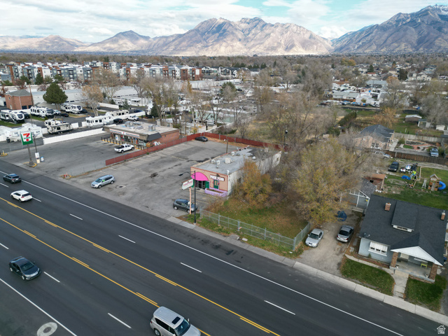 8475 South State Street Sandy, UT 84070 - Photo 17 of 31 Aerial view of residential area with a mountain backdrop