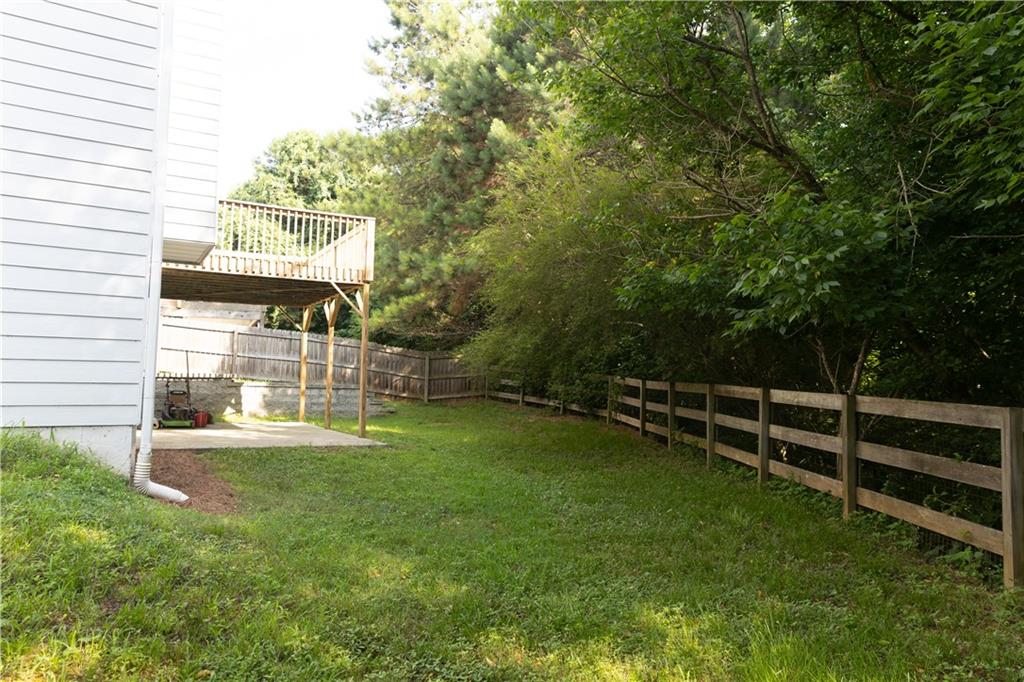 502 Streamside Place Canton, GA 30115 - Photo 32 of 33 a view of a house with a yard