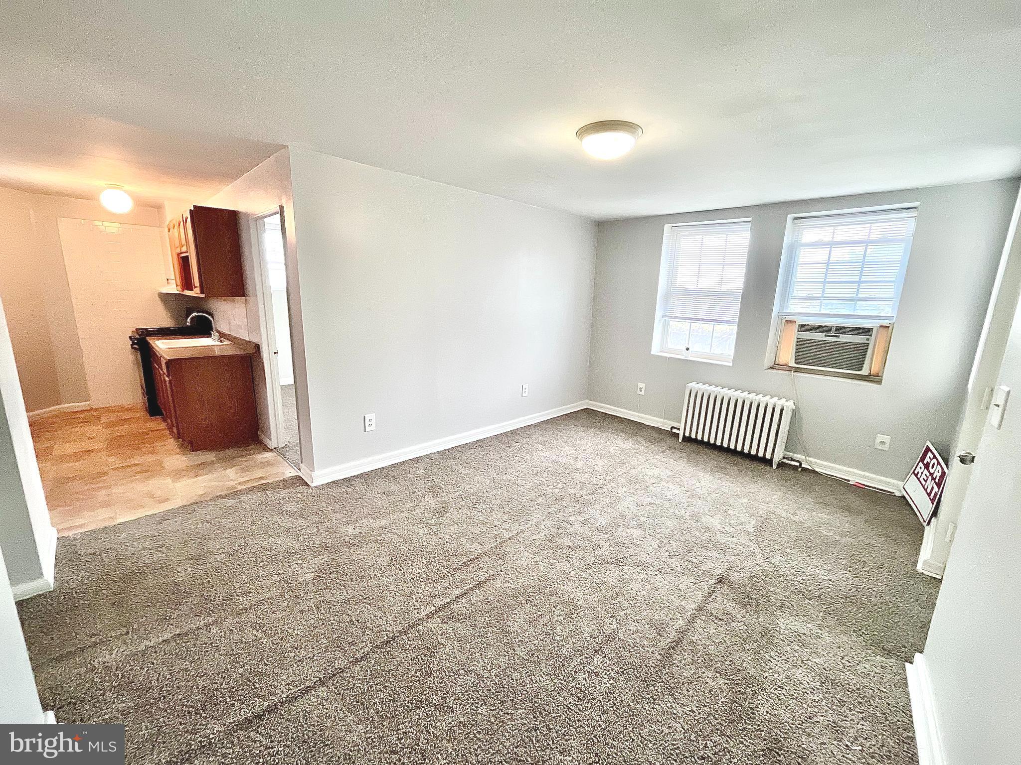 5615 Upland Way, Unit 1 Philadelphia, PA 19131 - Photo 3 of 10 a view of an empty room with a window